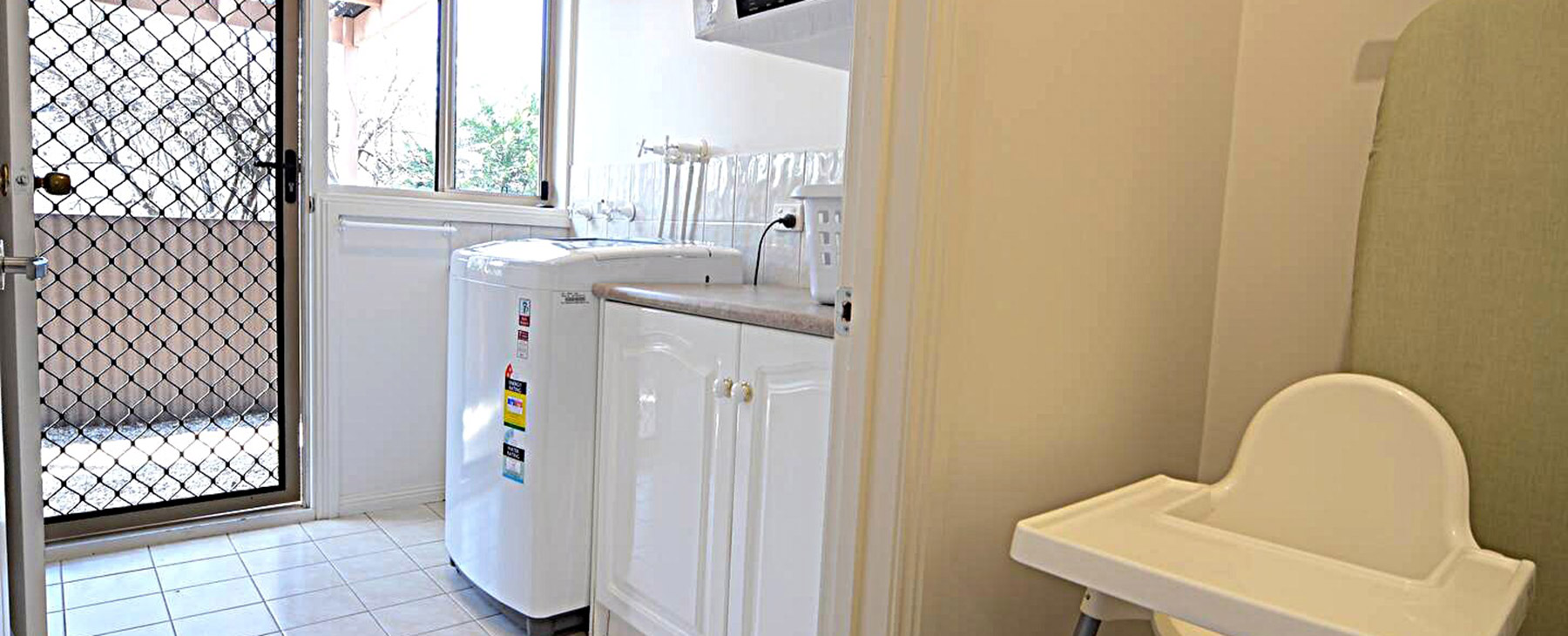 25--Family-washing-machine-and-dryer.--Clothes-line-outside