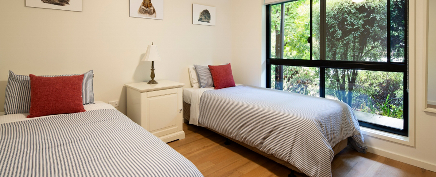 14-Spacious-third-bedroom.-Two-long-king-singles.--Double-glazed-windows-to-garden-outlook.--5-blanket-doonas-and-heating-for-winter