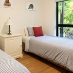 14-Spacious-third-bedroom.-Two-long-king-singles.--Double-glazed-windows-to-garden-outlook.--5-blanket-doonas-and-heating-for-winter